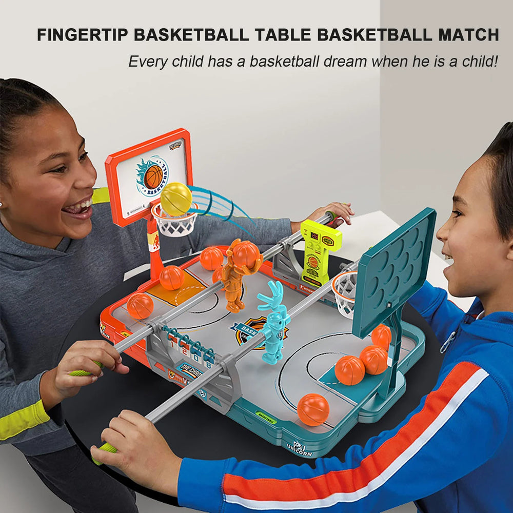 Two children playing with a fingertip basketball table game.