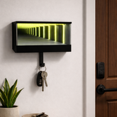 Key holder with green LED light on a wall next to a door