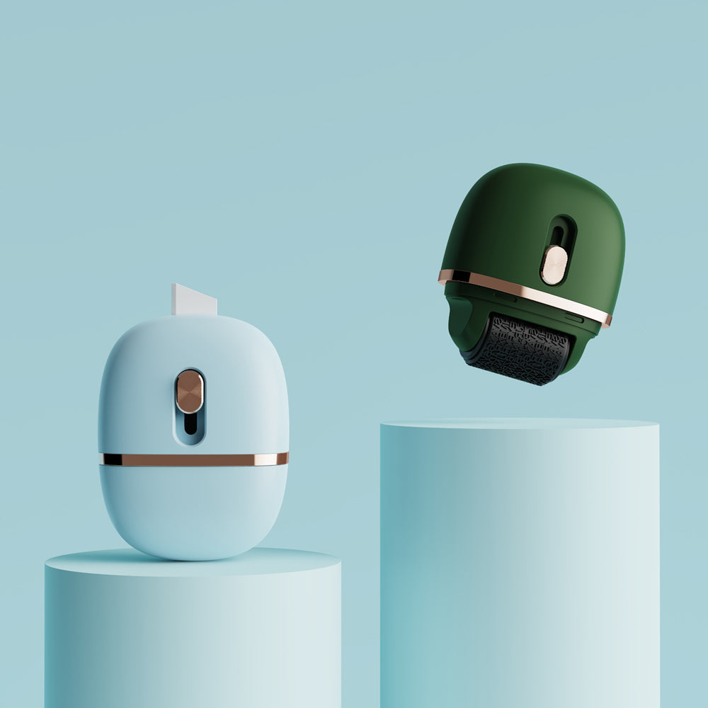 Two stamp rollers, one green and one white, on a light blue background.