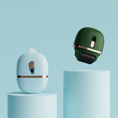 Two stamp rollers, one green and one white, on a light blue background.